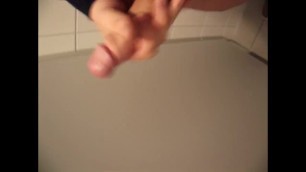 Jacking off and cum in public toilet