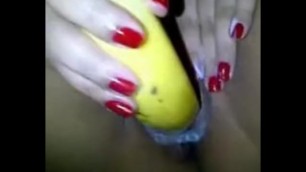 Indian_aunty_using_banana_with_condom_in_her_shaved_pussy