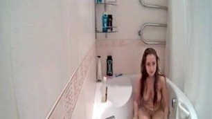 Beautiful blonde takes a bath
