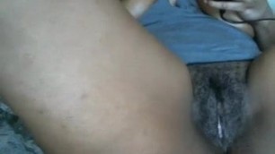Hanging tits on black girl fingering hairy pussy
