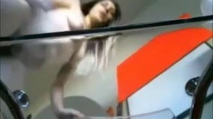 camwhore sits on glass table